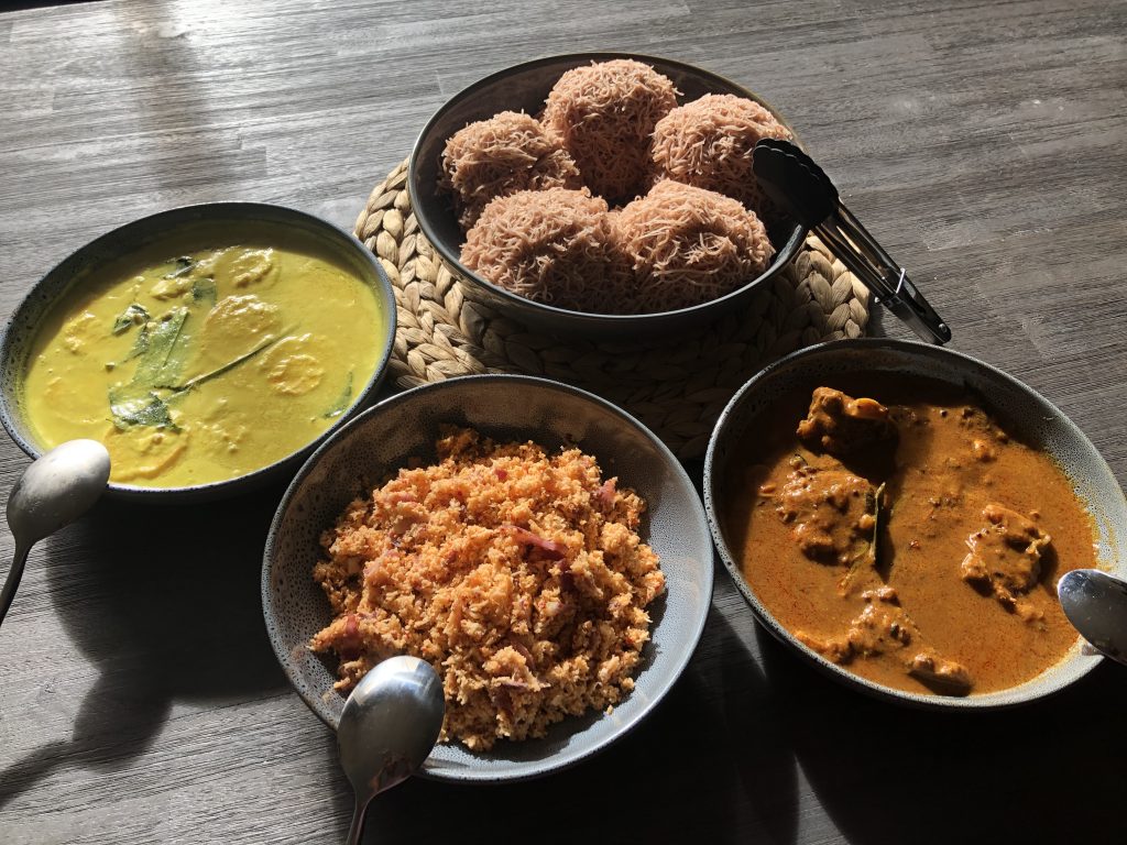 String hoppers with Egg white curry, Coconut Sambol, and Spicy fish curry